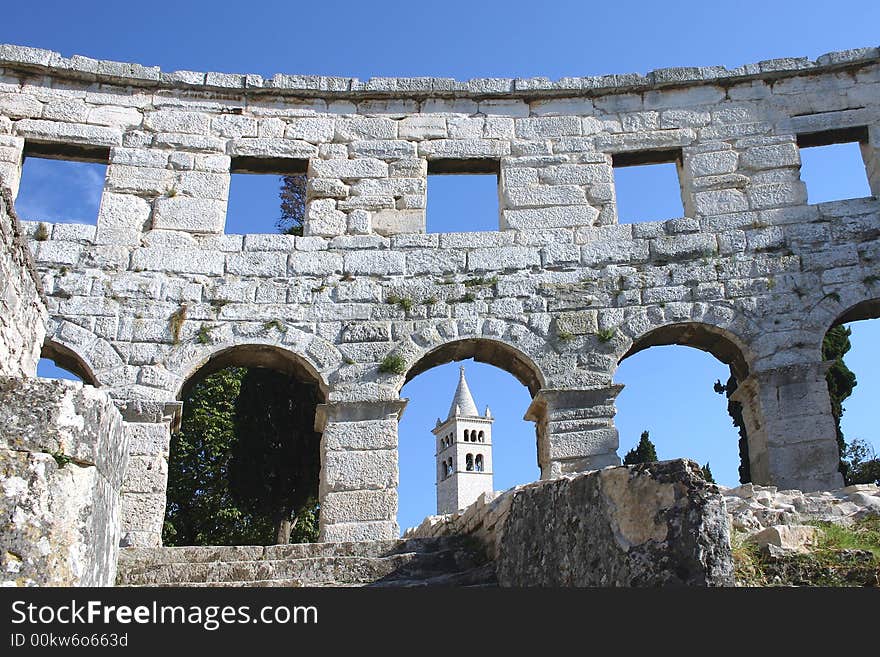 Belltower of the church of St. Anton. Seen from inside the amphitheatre in Pula, Croatia. Belltower of the church of St. Anton. Seen from inside the amphitheatre in Pula, Croatia