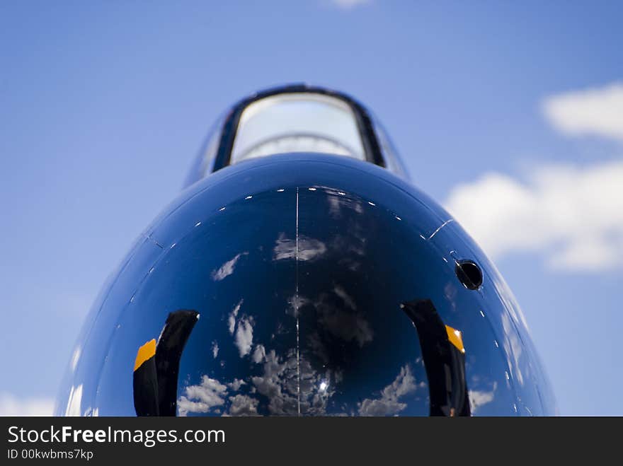 War bird nose cone and cloudy blue skies. War bird nose cone and cloudy blue skies