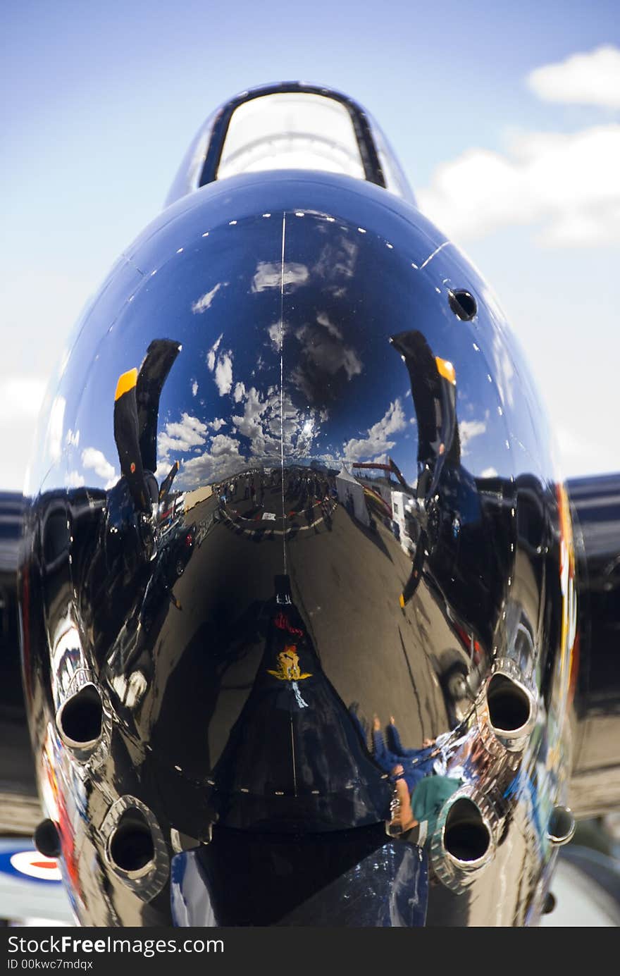 War bird nose cone and cloudy blue skies. War bird nose cone and cloudy blue skies