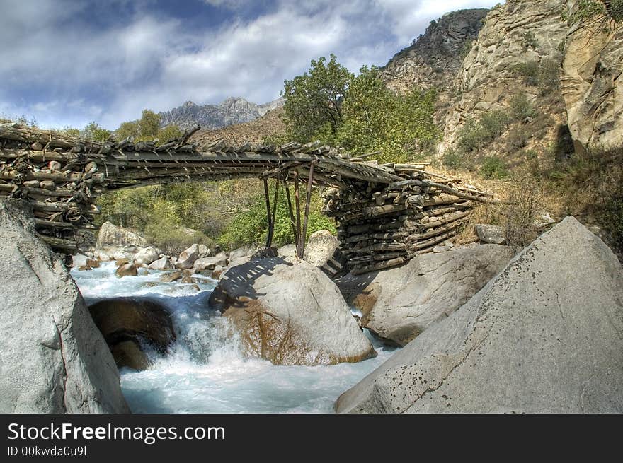 Hand-made bridge build of wood and stone