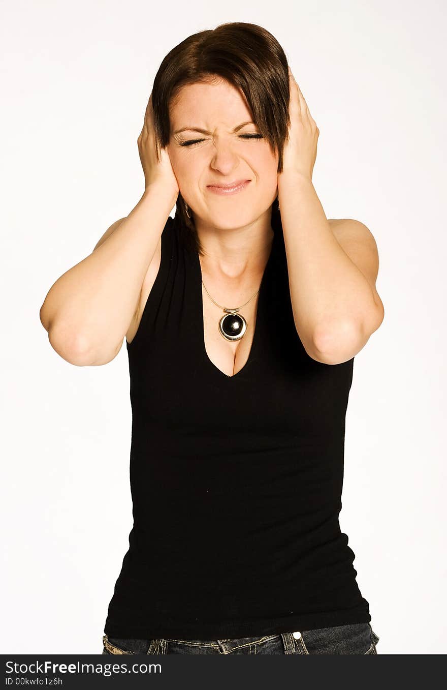 Beautiful brunette girl in black shirt posing on light background