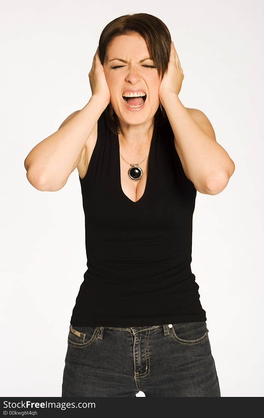 Beautiful brunette girl in black shirt posing on light background