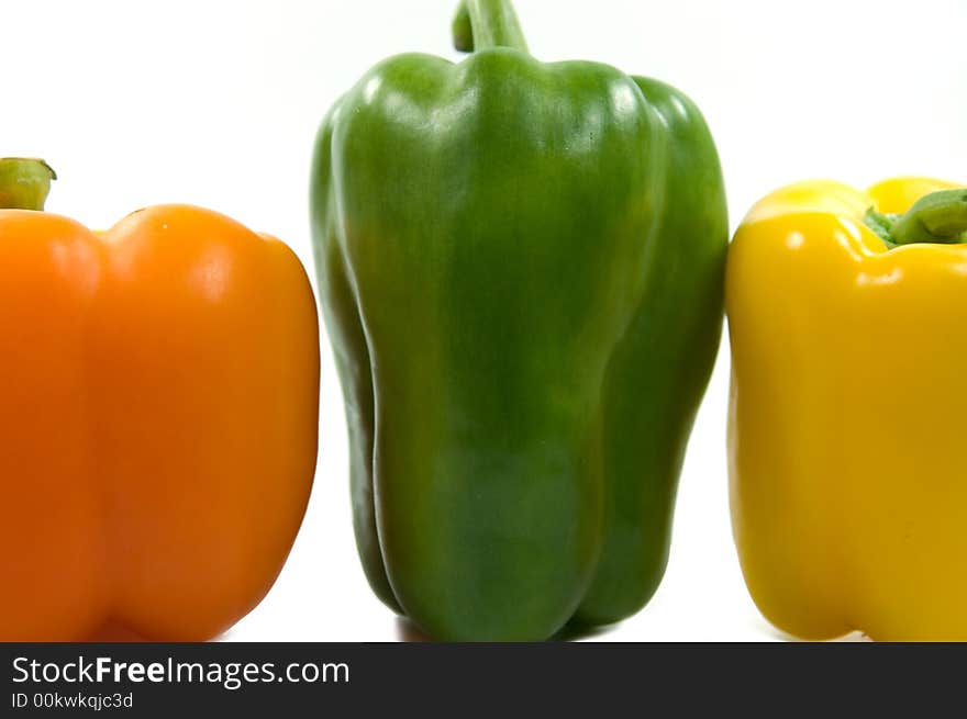 Colorful peppers on white background