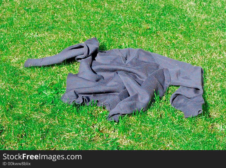 A sweater left in the middle of a field. A sweater left in the middle of a field