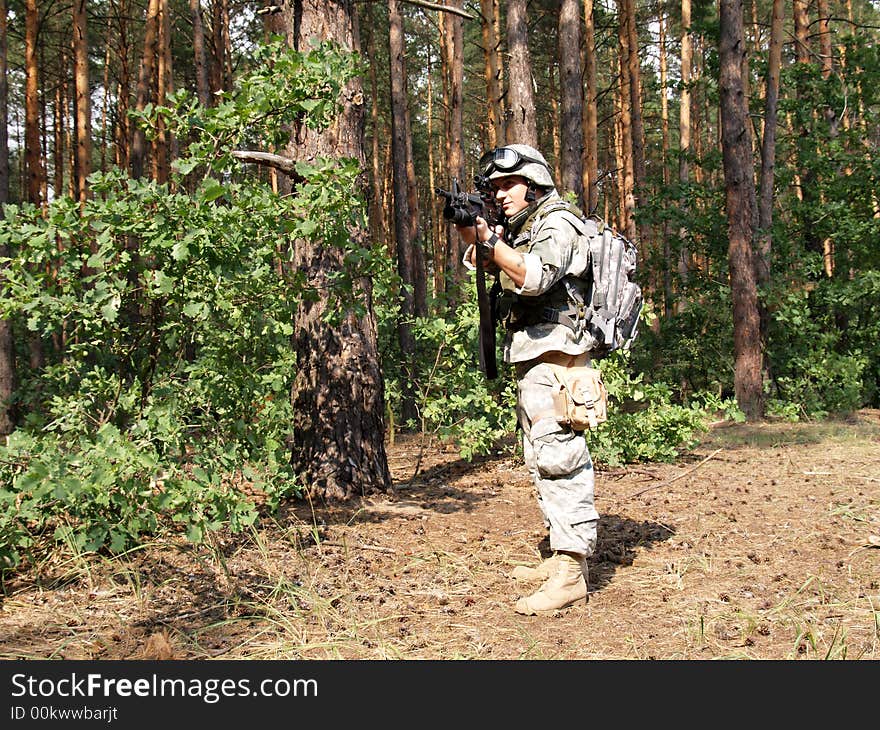 Soldier in ACU holding the Colt M4 carbine with M203 grenade launcer. Soldier in ACU holding the Colt M4 carbine with M203 grenade launcer