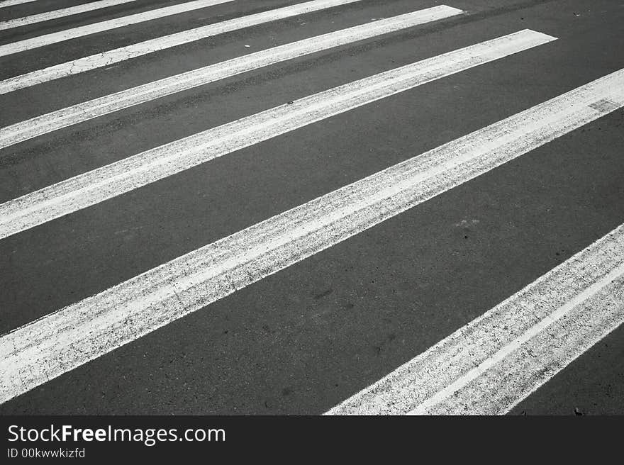 White painted pedestrian crossing on the road