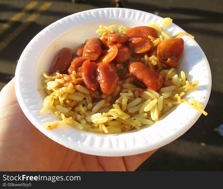 Photo of bean and rice sampler at a hispanic festival. Free samples of food are sometimes offered by manufacturers.