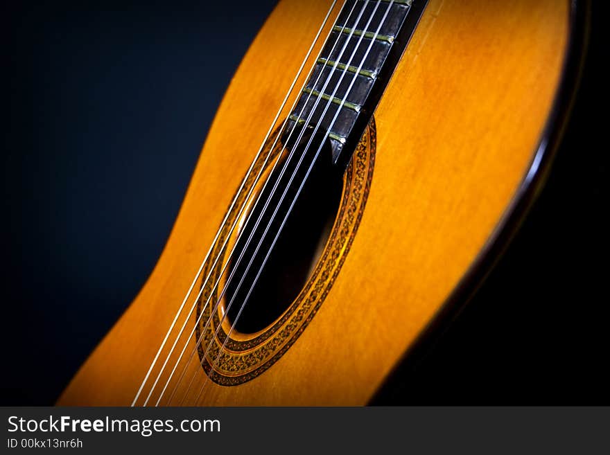 A guitar in detail displays it's beauty beyond it's music. A guitar in detail displays it's beauty beyond it's music