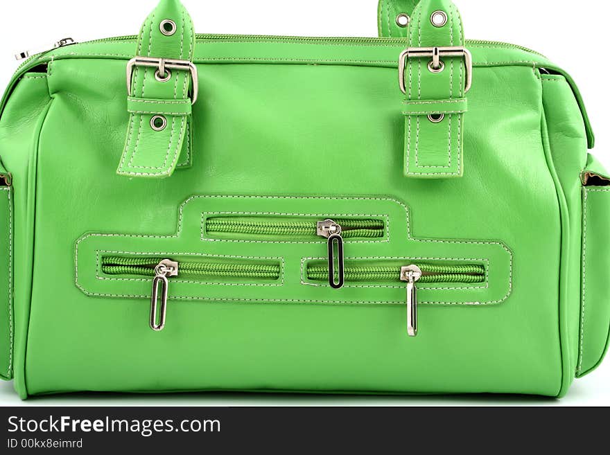 Zippers on a green bag