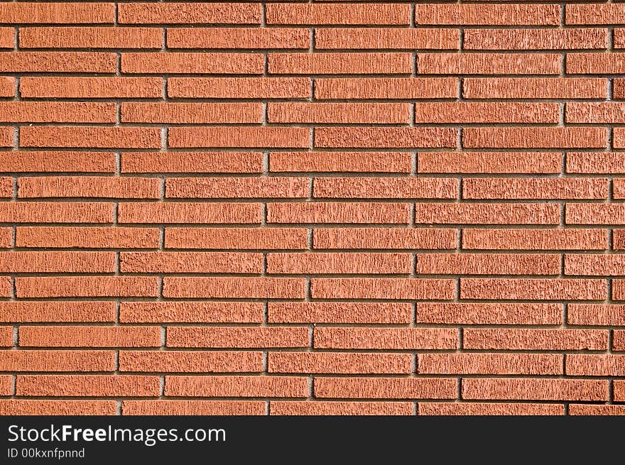 A Rough Red Brick Wall useful for backgrounds