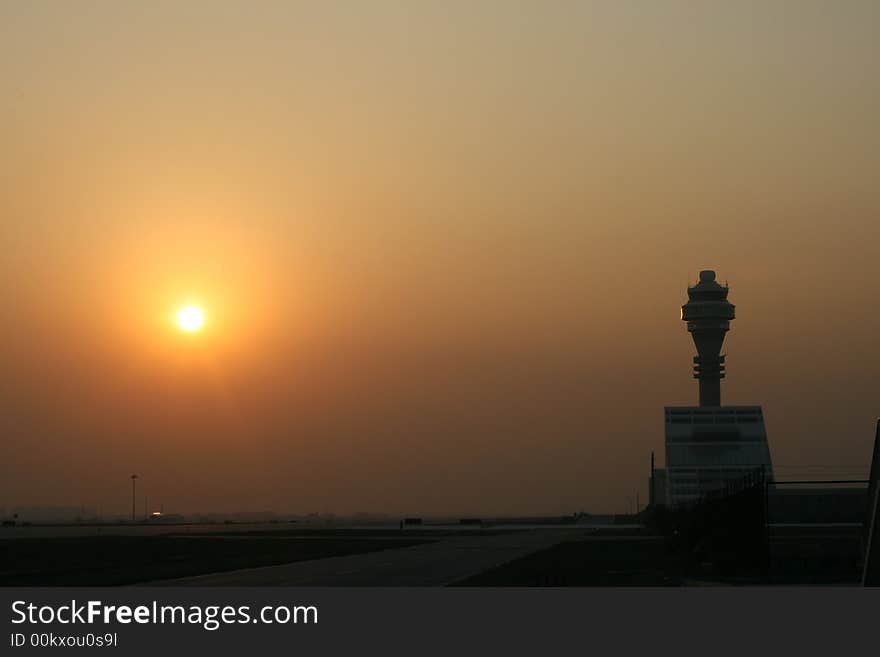 Sunset in the airport, I stand on the parking apron