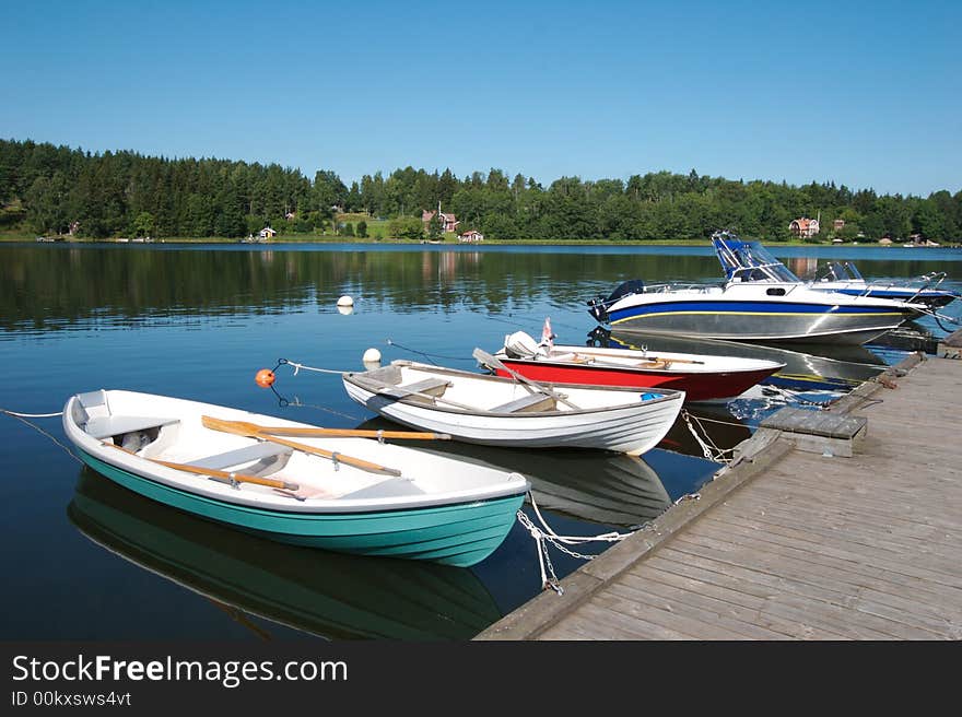 Boats docked in the swedish skargarden during daytime. Boats docked in the swedish skargarden during daytime