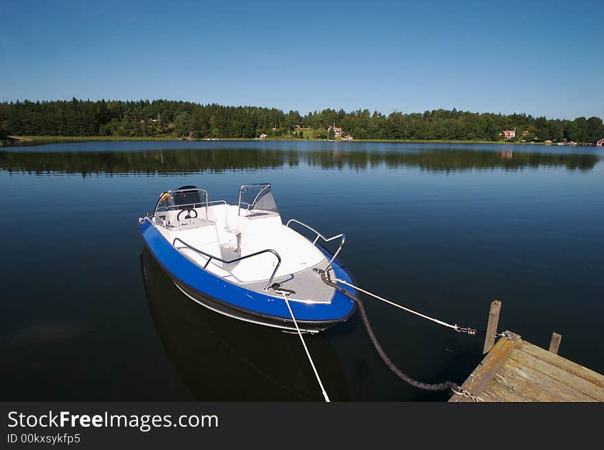 Boats docked in the swedish skargarden during daytime. Boats docked in the swedish skargarden during daytime