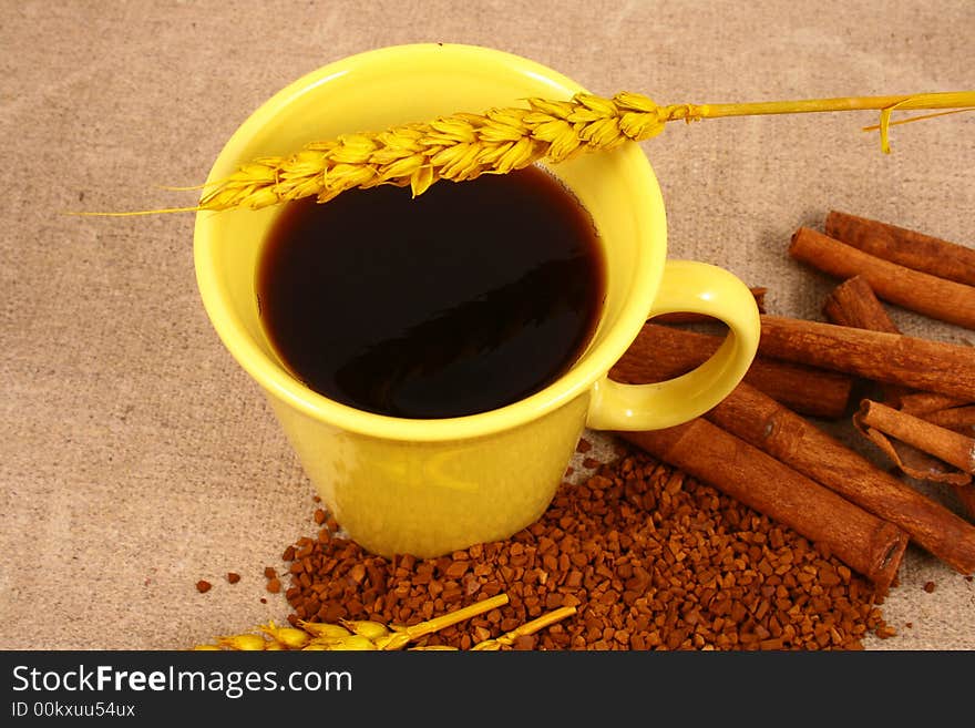 Cup of coffee with coffee grain