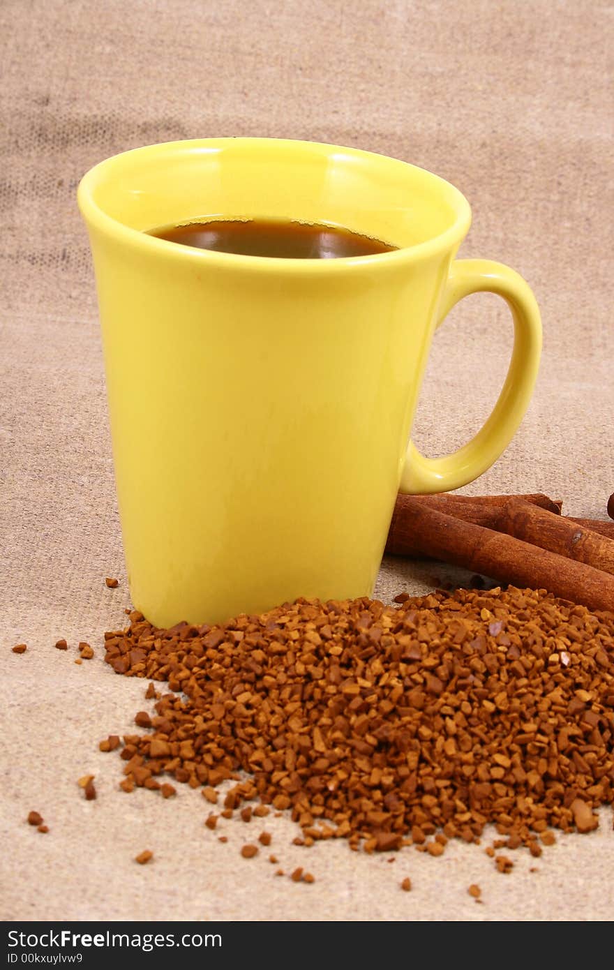 Cup of coffee with coffee grain