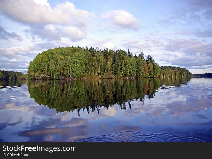 Trees reflect in river Vuoksa