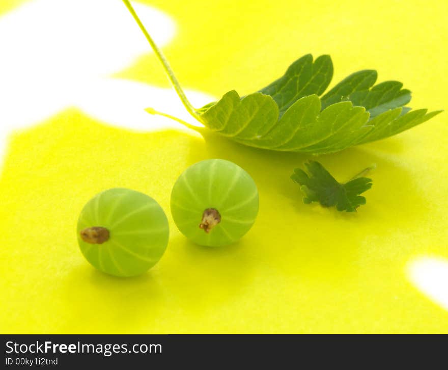 Goose berry on a yellow background