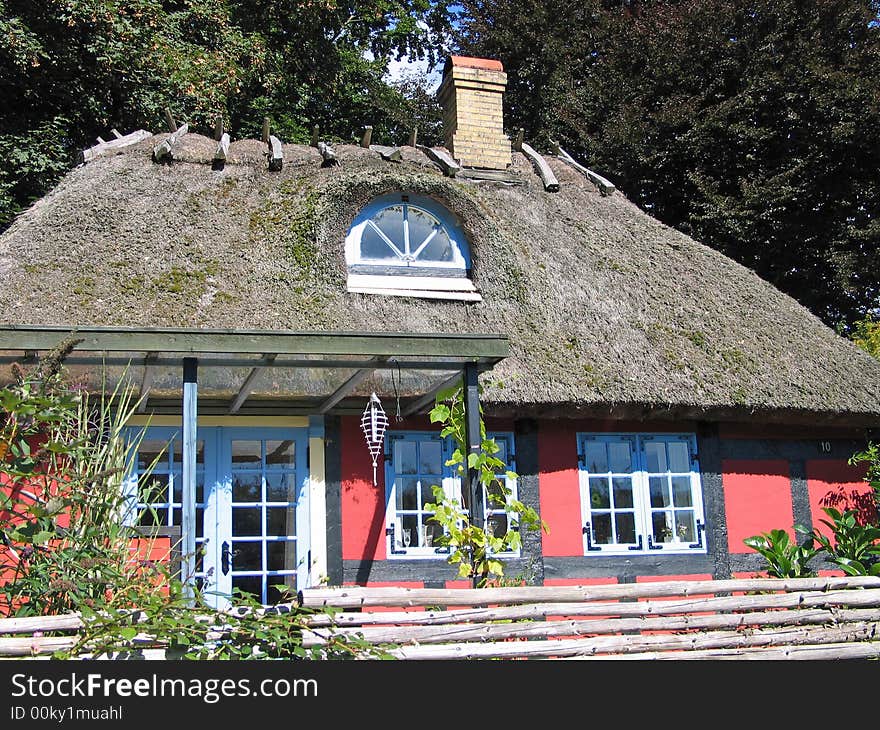 Danish old style typical country home with thached roof. Danish old style typical country home with thached roof