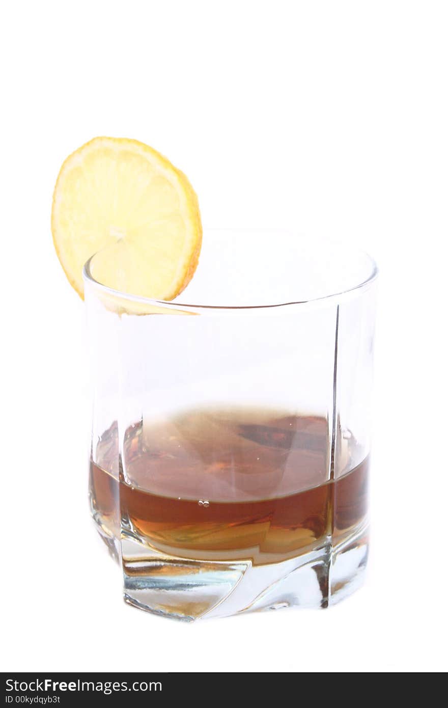 Cognac in a glass, with lemon