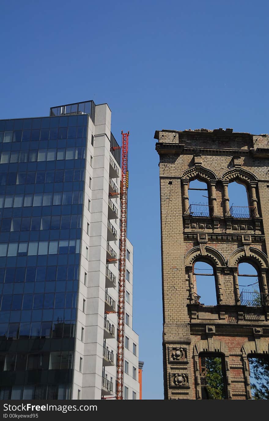 Modern business building and ruin of old building. Modern business building and ruin of old building