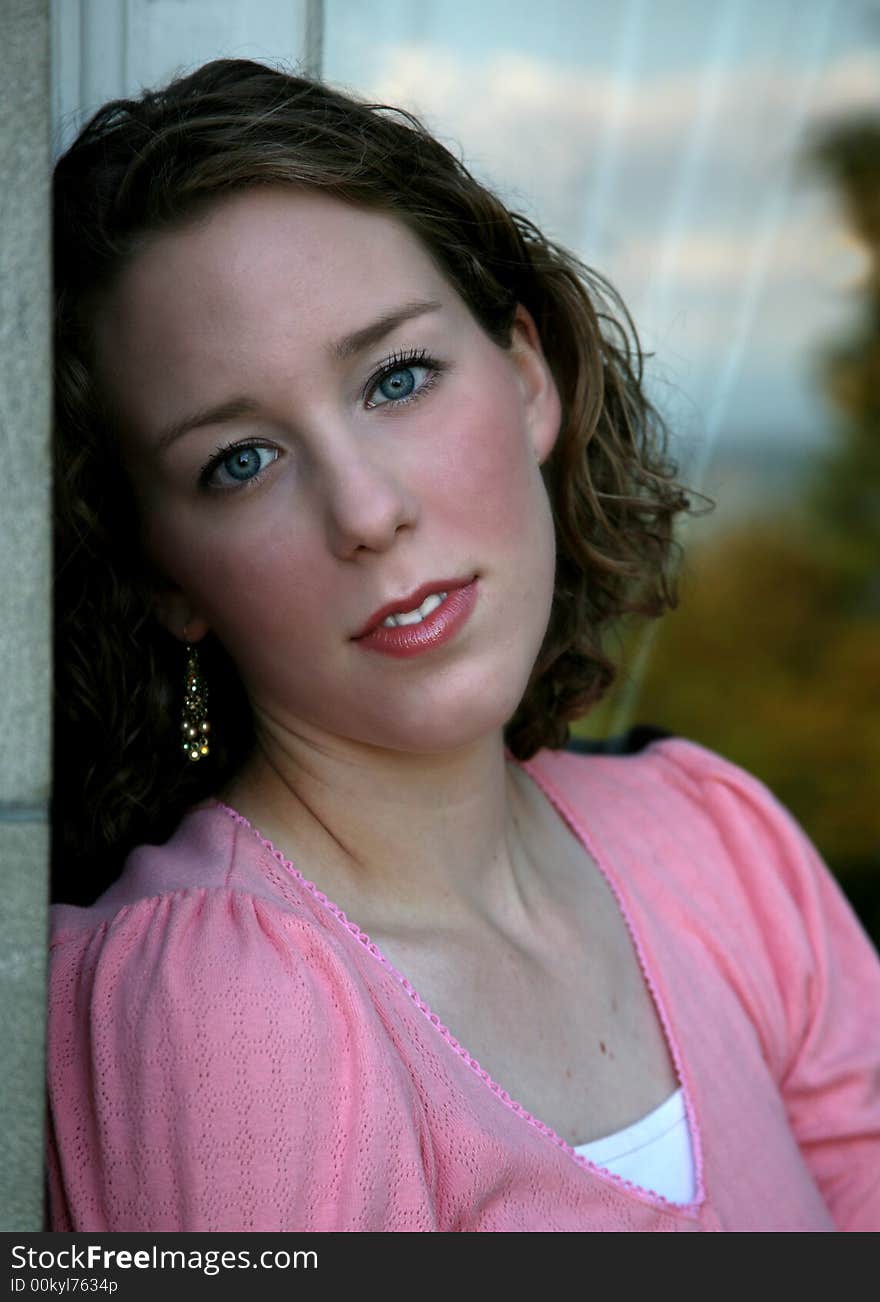 Portrait of a highschool senior sitting in front of a window. Portrait of a highschool senior sitting in front of a window