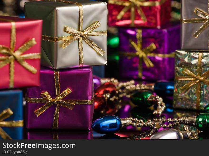 Silver and Purple packages with gold ribbon