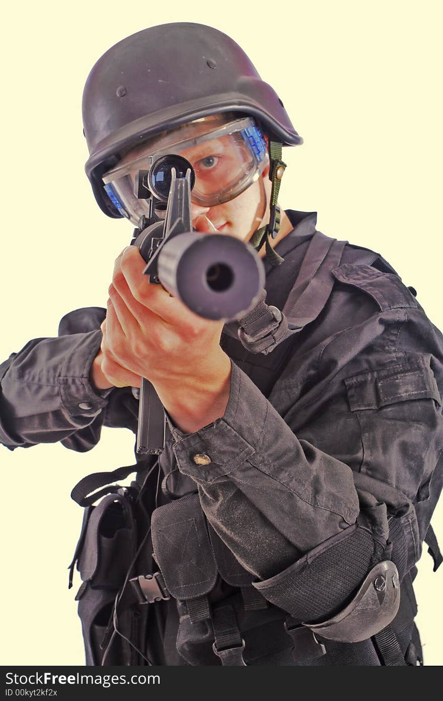 Shot of a soldier holding gun. Uniform conforms to special services(soldiers) of the NATO countries. Shot of a soldier holding gun. Uniform conforms to special services(soldiers) of the NATO countries.
