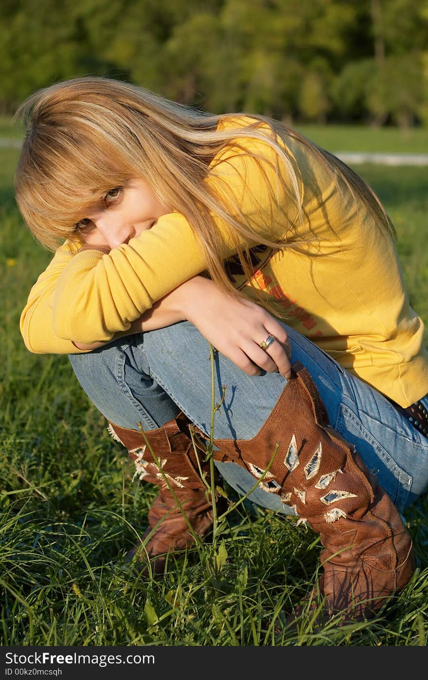 Blond girl squatting