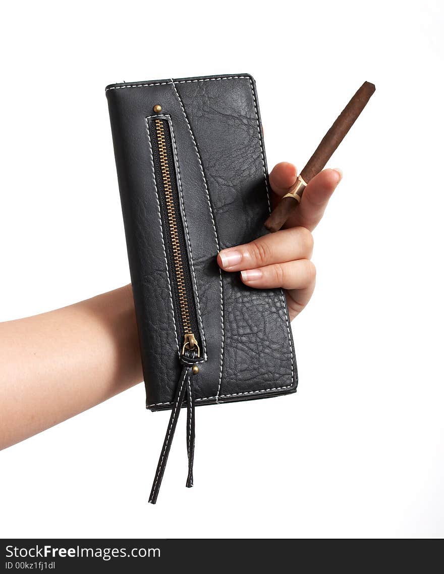 A hand holding a cigar and a black leather purse