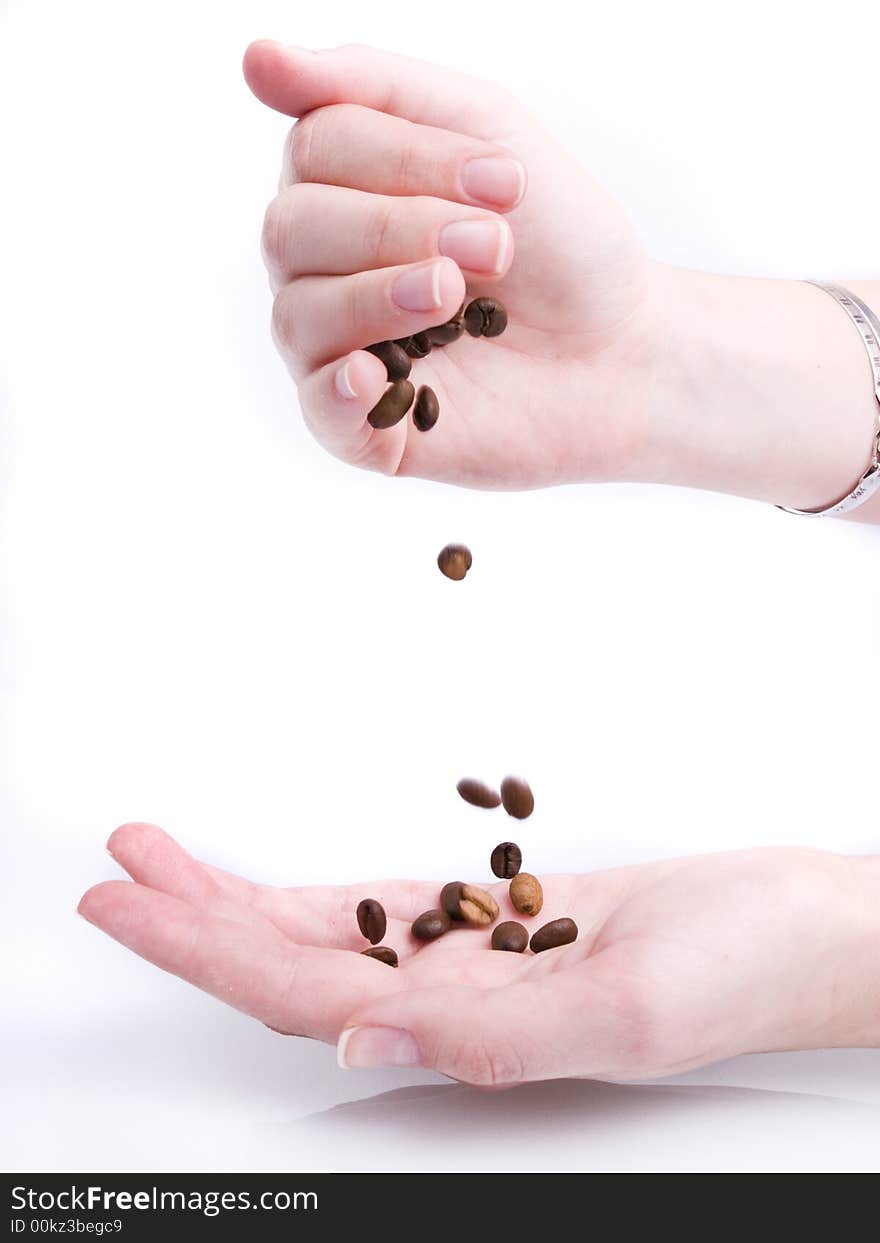 Handful of coffee beans on white background