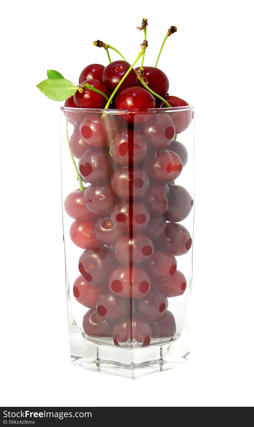 Glass transparent filled with red cherries isolated. Glass transparent filled with red cherries isolated