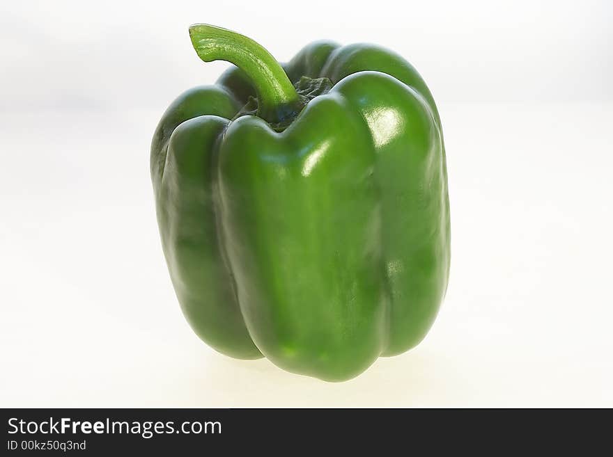 Green peppers on white background.