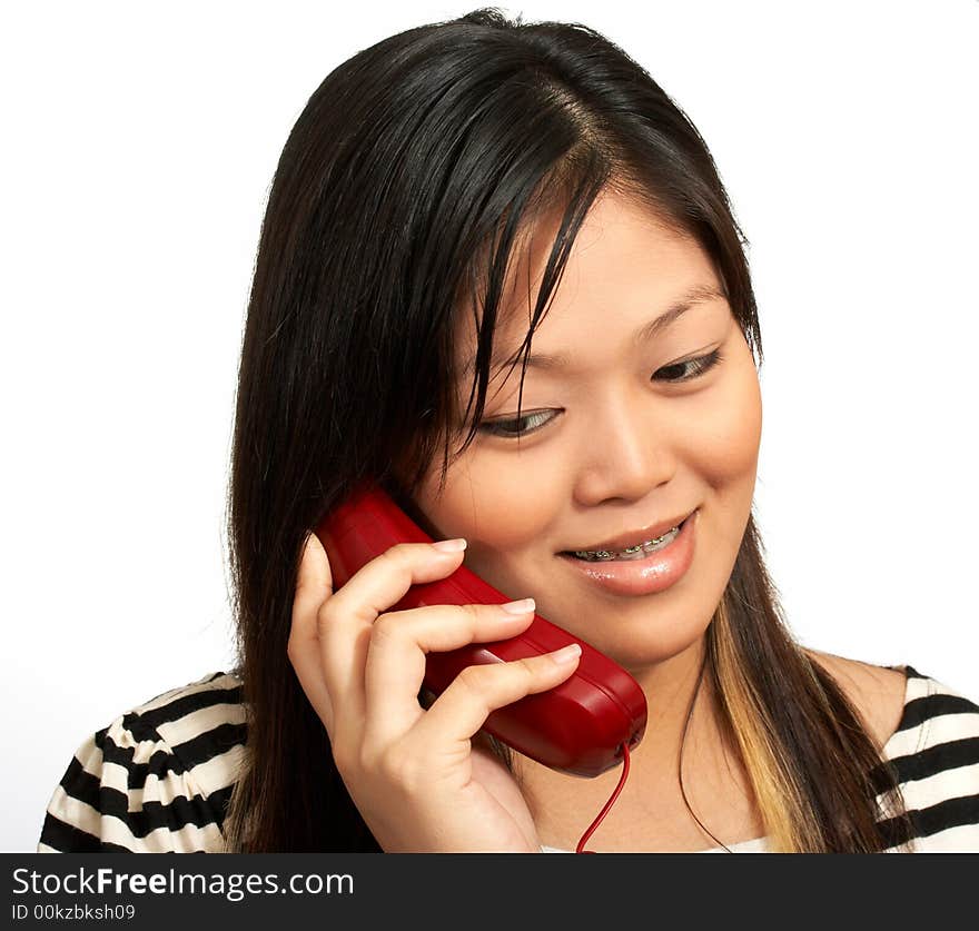 A smiling woman talking on the phone. A smiling woman talking on the phone