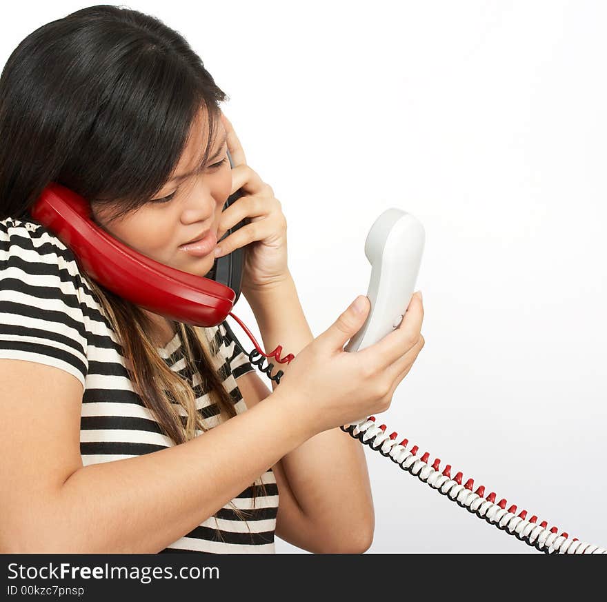 A woman answering multiple phones over a white background. A woman answering multiple phones over a white background