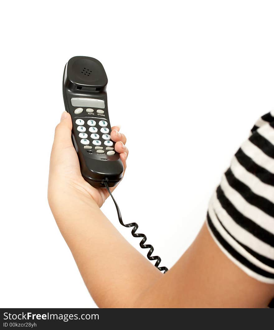 A hand holding a telephone handset over a white background. A hand holding a telephone handset over a white background