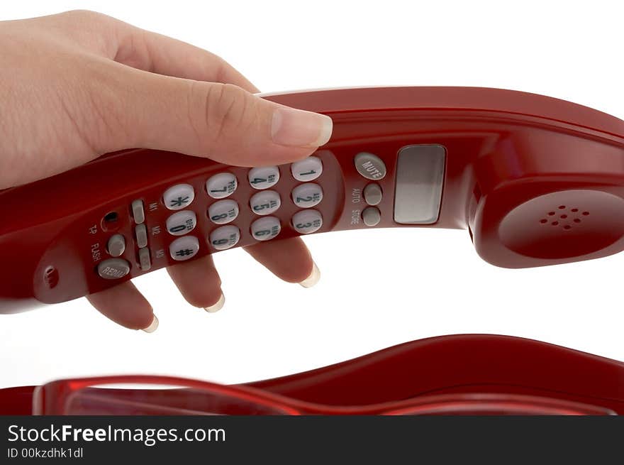 A hand picking up a phone over a white background. A hand picking up a phone over a white background