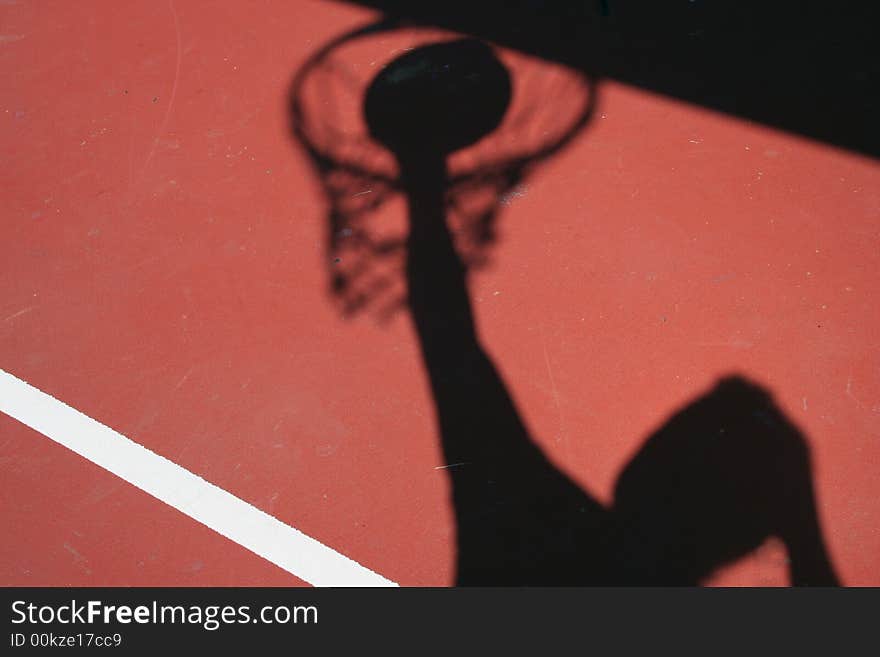 Basketball player dunking