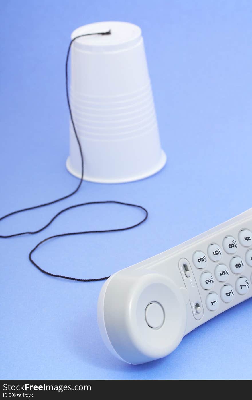 Photo of a telephone over a blue background. Photo of a telephone over a blue background