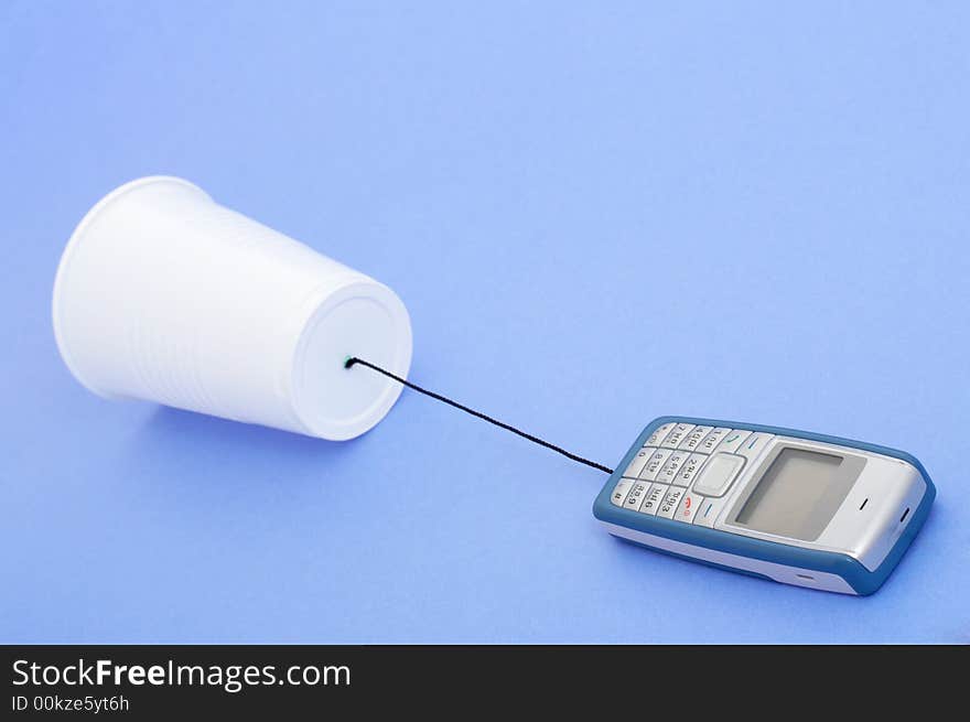 Photo of a telephone over a blue background. Photo of a telephone over a blue background