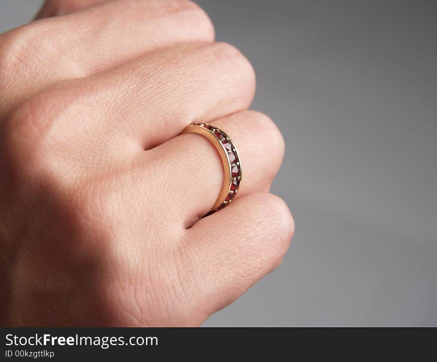 Womans hand with red rubin ring