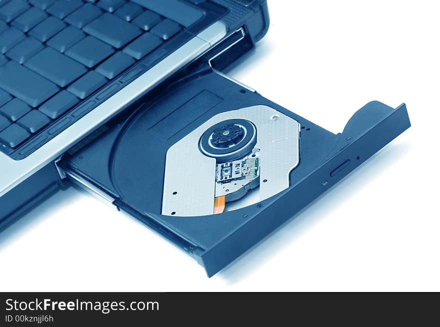 Open CD-ROM drive on a laptop isolated. Open CD-ROM drive on a laptop isolated