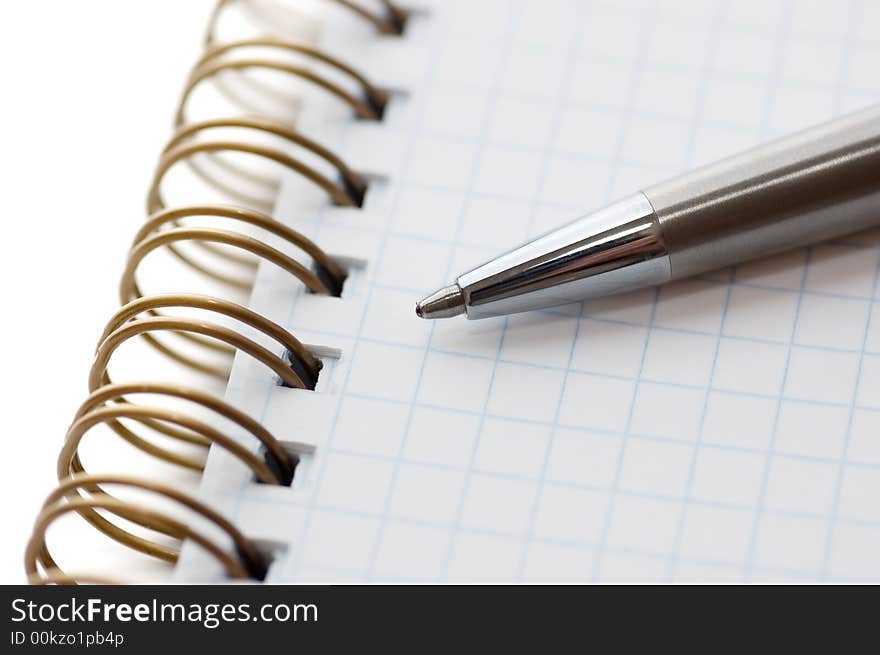 Pen and notepad on a white background. Pen and notepad on a white background