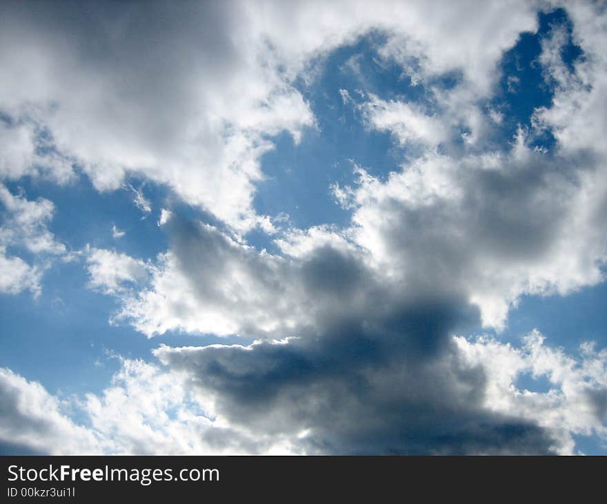 Sky with a darkness moving in, on a sunny day. Sky with a darkness moving in, on a sunny day.