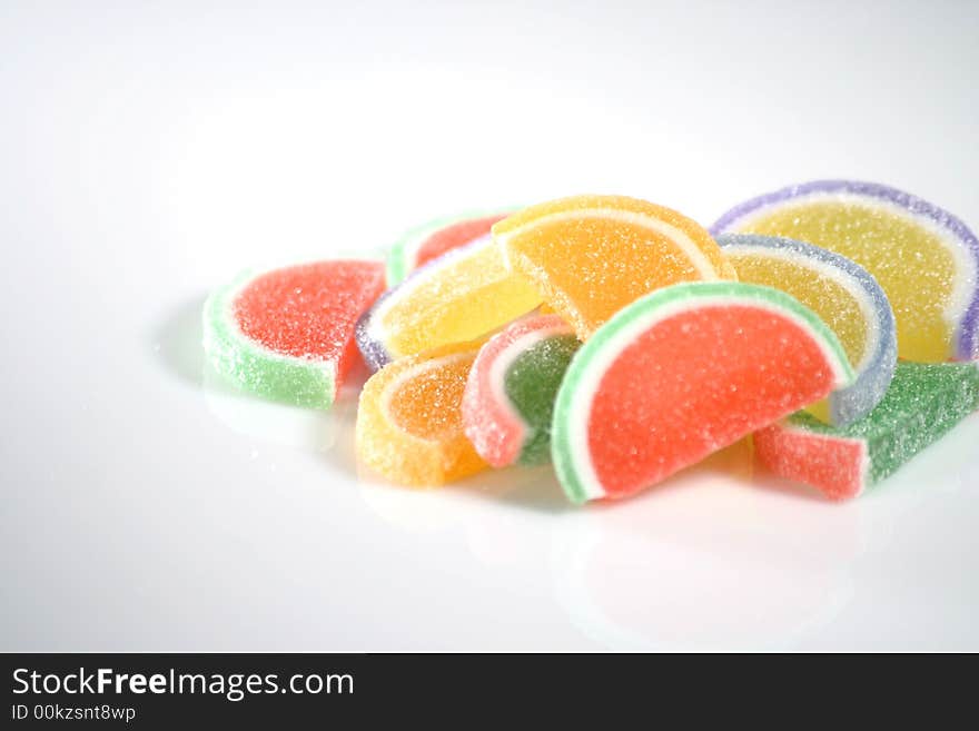 Pile of multiple sugar coated fruit slice gummy candy. Pile of multiple sugar coated fruit slice gummy candy