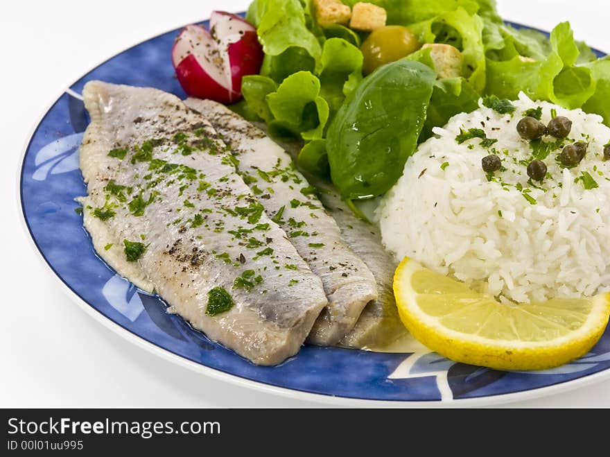 Gourmet young herring fillets with salad.