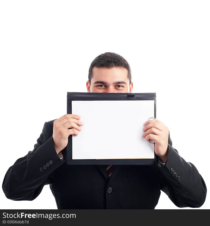 Businessman holding a blank paper on clipboard in front of his face - isolated on white. Businessman holding a blank paper on clipboard in front of his face - isolated on white