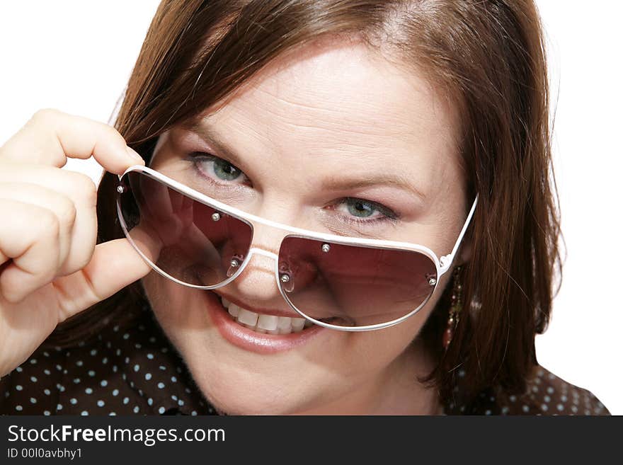 Closeup of a beautiful model wearing stylish sunglasses.  White background. Closeup of a beautiful model wearing stylish sunglasses.  White background.