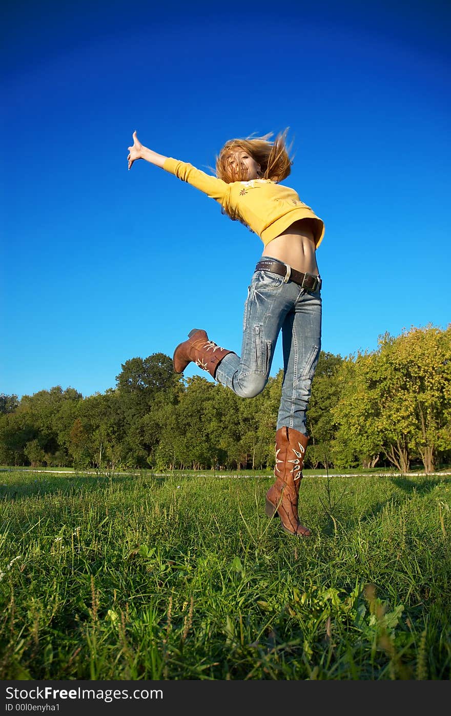 Blond girl jumping