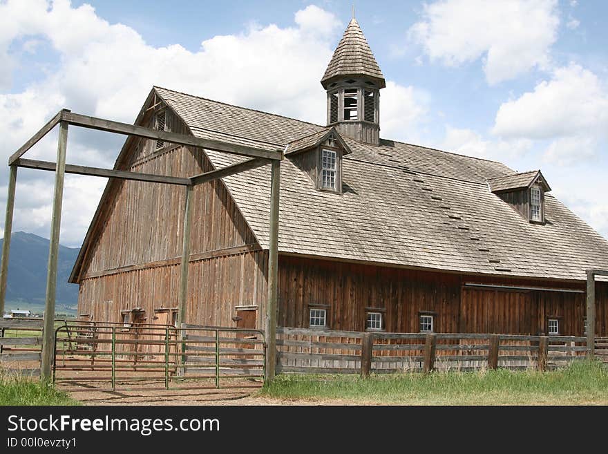 100 year old barn sunny cloud day