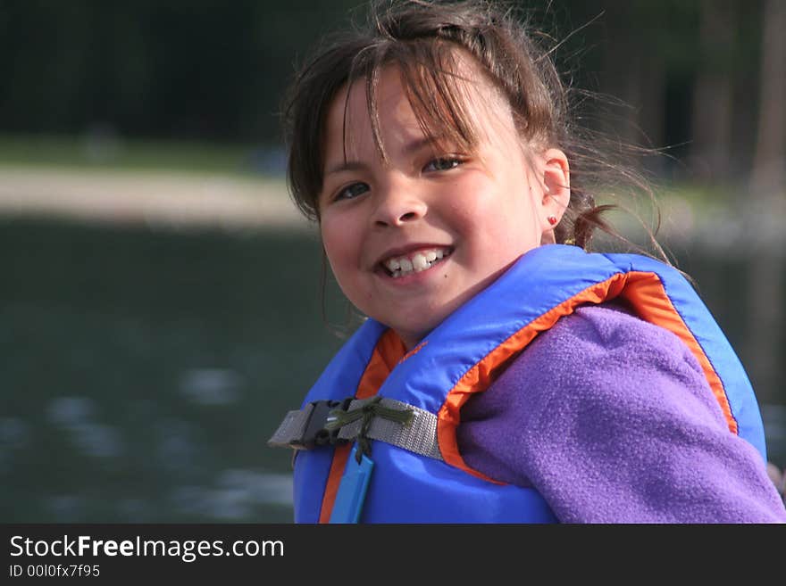 Happy little girl having fun on a boat. Happy little girl having fun on a boat